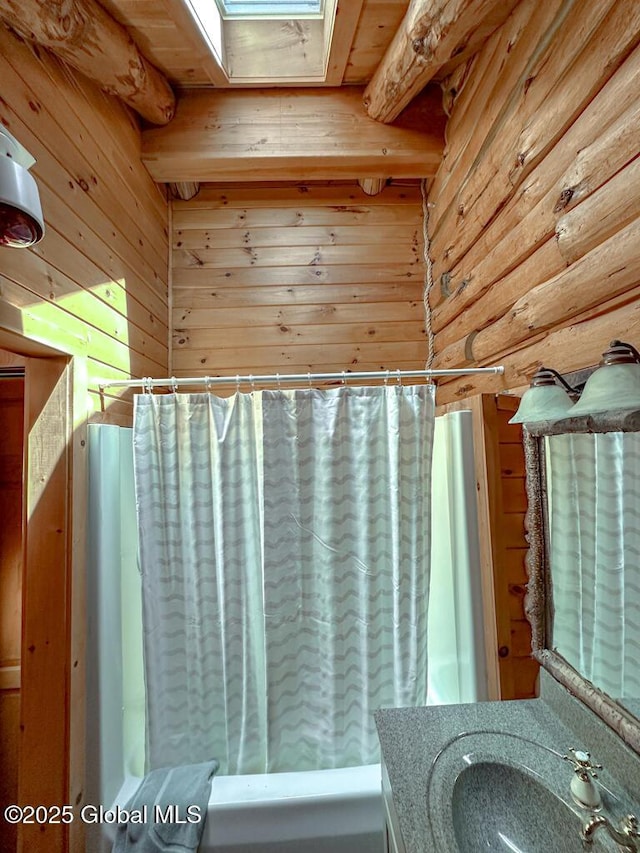 25 Birch Dr, Bolton, NY 12824 - full bathroom featuring wood walls, a skylight, vanity, and curtained shower