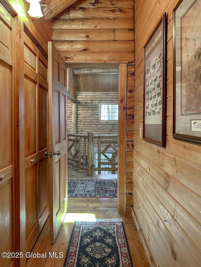 25 Birch Dr, Bolton, NY 12824 - corridor with wooden walls, hardwood / wood-style flooring, and an upstairs landing
