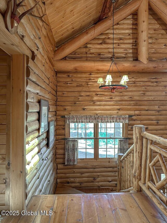 25 Birch Dr, Bolton, NY 12824 - unfurnished room with log walls, wood-type flooring, beam ceiling, and wood ceiling