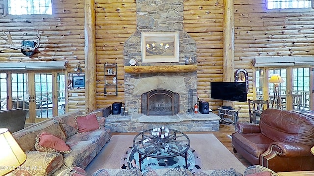 25 Birch Dr, Bolton, NY 12824 - living room featuring french doors, log walls, a fireplace, wood finished floors, and healthy amount of natural light