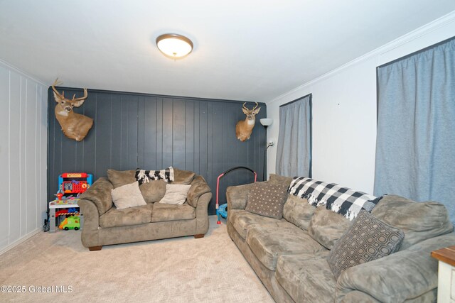 carpeted living room with ornamental molding