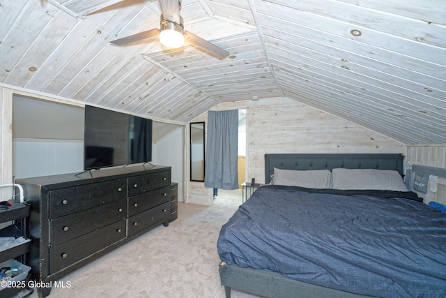 bedroom with wood walls, ceiling fan, vaulted ceiling, and carpet flooring