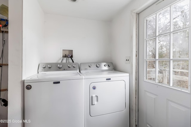 laundry area with washing machine and clothes dryer and laundry area