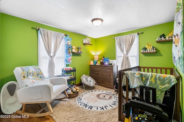 bedroom featuring a crib