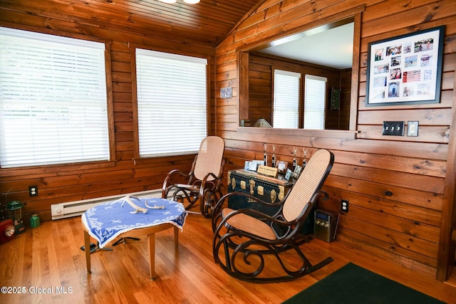 living area featuring wooden walls, wood ceiling, vaulted ceiling, and wood finished floors