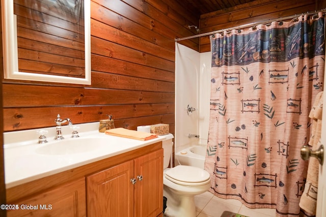 bathroom with toilet, wood walls, tile patterned flooring, and vanity