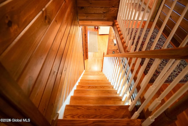 stairs with wood walls