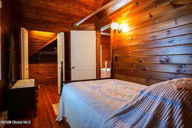 bedroom featuring wood-type flooring, wood walls, a closet, lofted ceiling, and wood ceiling