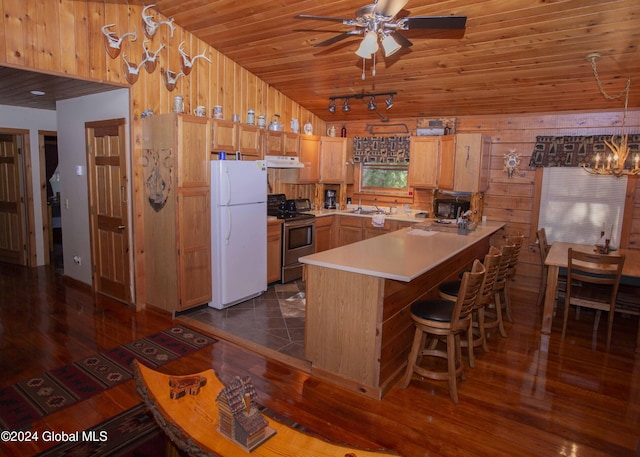 kitchen with wooden ceiling, stainless steel electric range oven, freestanding refrigerator, vaulted ceiling, and a peninsula
