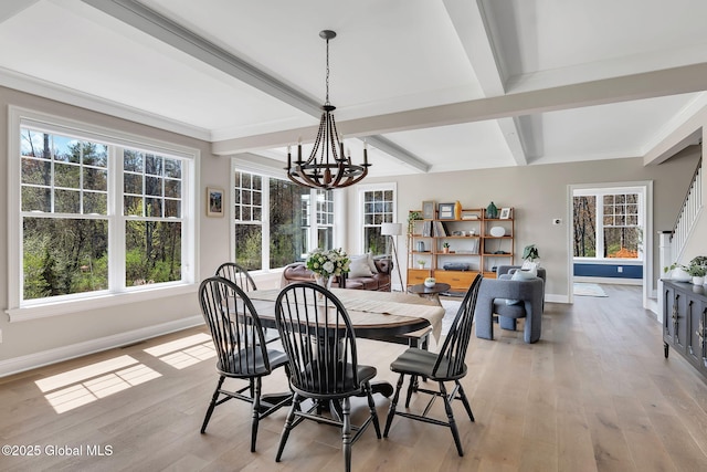 dining space featuring baseboards, beamed ceiling, a notable chandelier, and light wood-type flooring