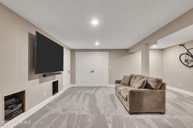 living area featuring carpet floors, baseboards, and recessed lighting