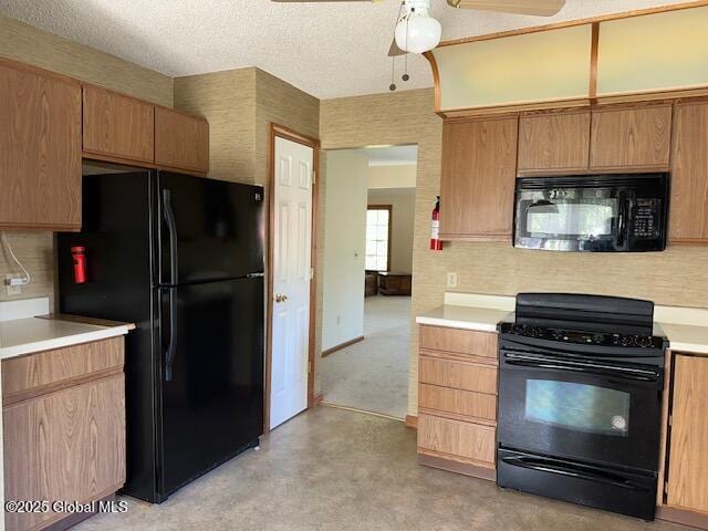 kitchen with light countertops, a textured ceiling, a ceiling fan, decorative backsplash, and black appliances