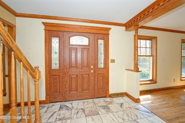 entryway featuring visible vents, ornamental molding, stairs, marble finish floor, and baseboards