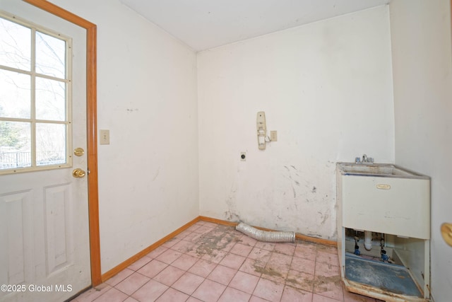 laundry room featuring baseboards, laundry area, and electric dryer hookup
