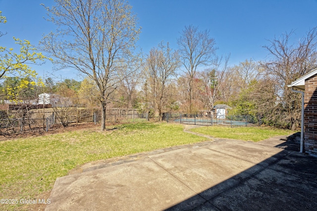 view of yard featuring fence and a patio area