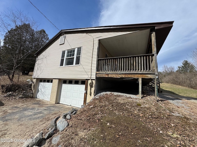 view of front of house with a garage and aphalt driveway