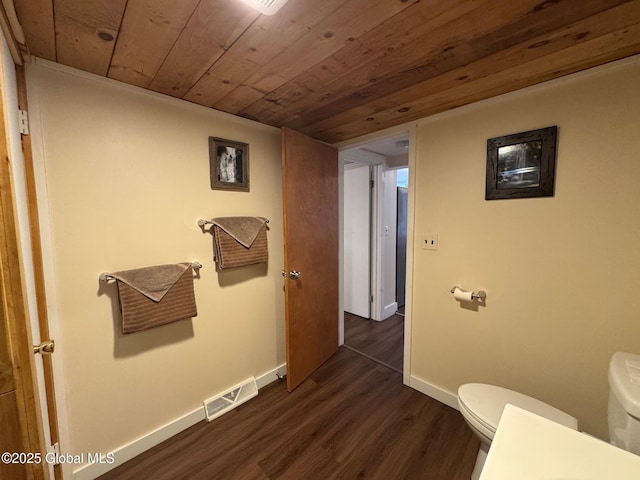 bathroom featuring visible vents, baseboards, wooden ceiling, toilet, and wood finished floors
