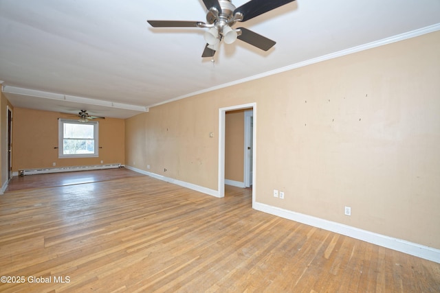 spare room featuring crown molding, ceiling fan, light wood-style floors, a baseboard heating unit, and baseboards