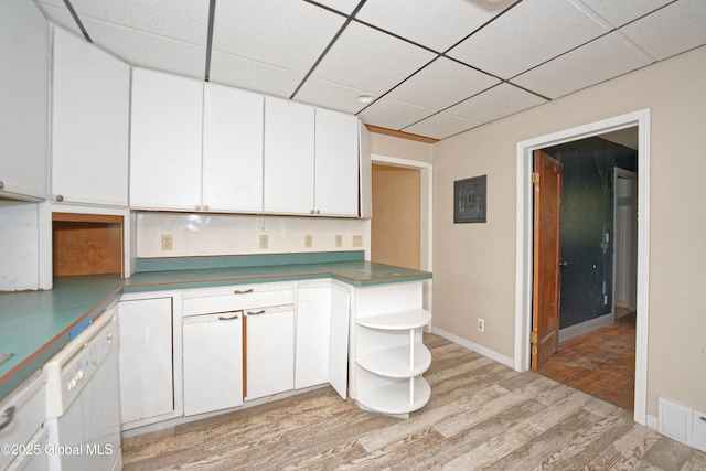 kitchen featuring white dishwasher, open shelves, light wood-type flooring, visible vents, and white cabinets