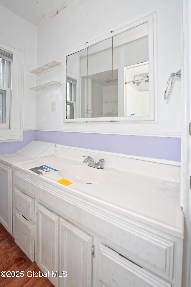 bathroom featuring vanity and wood finished floors