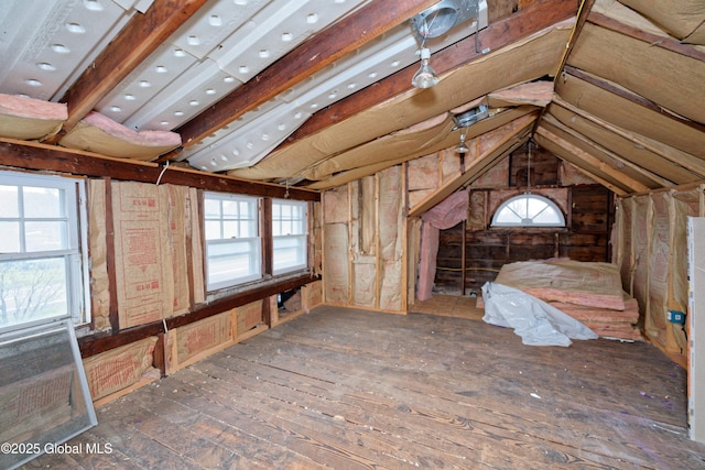 unfinished attic featuring plenty of natural light