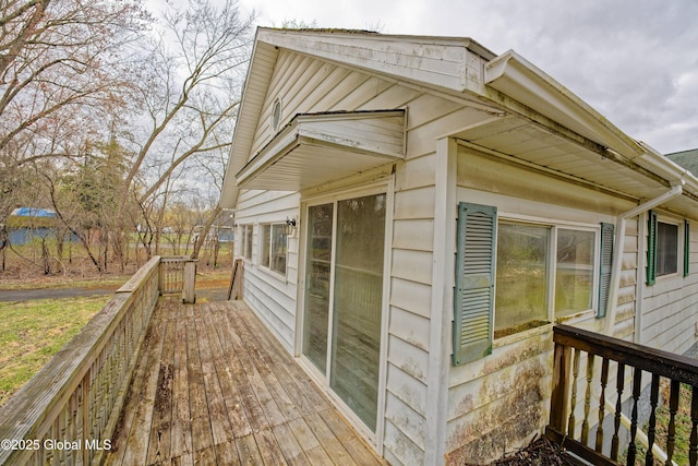 view of property exterior featuring a deck