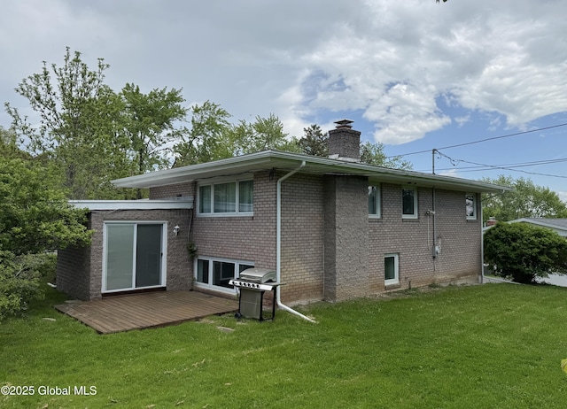 15 Campus View Dr, Colonie, NY 12211 - back of house featuring a chimney, a deck, brick siding, and a yard