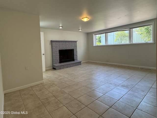 15 Campus View Dr, Colonie, NY 12211 - unfurnished living room with tile patterned flooring, a fireplace with raised hearth, and baseboards