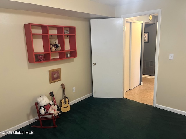 interior space featuring visible vents and dark colored carpet