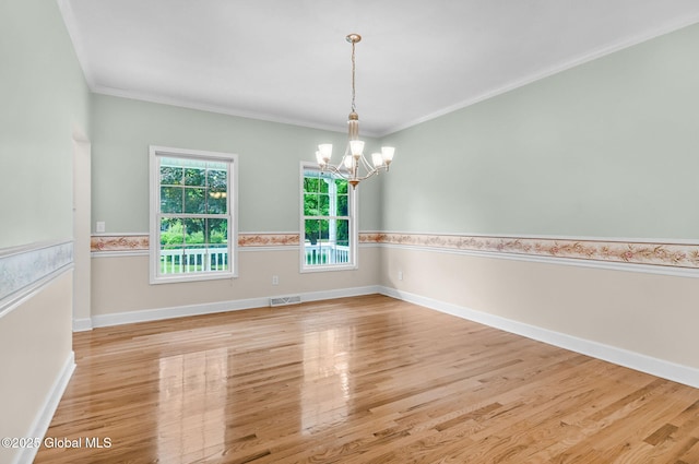 23 Jarose Pl, Clifton Park, NY 12065 - empty room featuring a chandelier, wood finished floors, ornamental molding, and baseboards