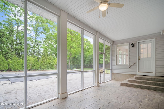 23 Jarose Pl, Clifton Park, NY 12065 - unfurnished sunroom with a ceiling fan, entry steps, and view of wooded area
