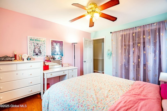 bedroom featuring dark wood-style flooring and ceiling fan