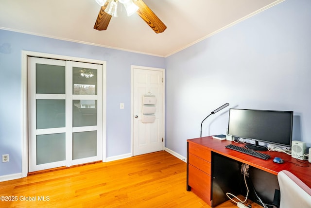 home office with baseboards, ceiling fan, crown molding, and light wood-style flooring