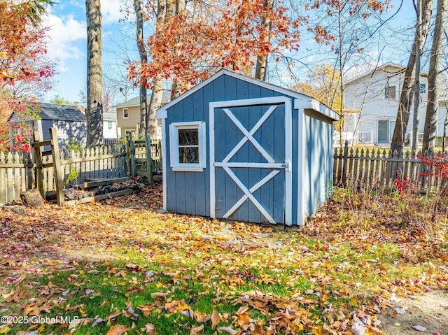 view of shed with a fenced backyard