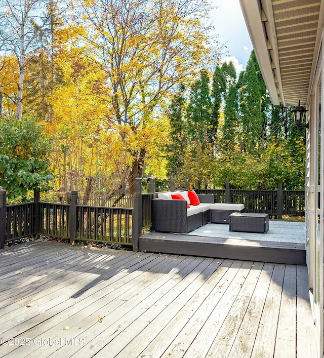 wooden terrace with outdoor lounge area
