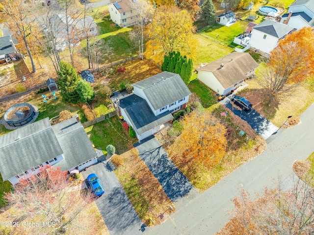 birds eye view of property with a residential view