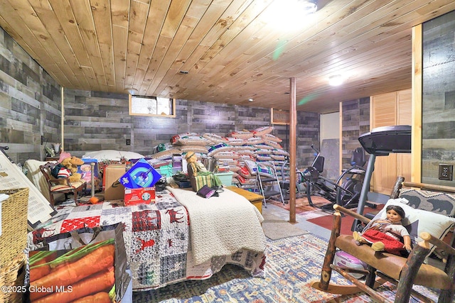 bedroom with wood ceiling and wooden walls