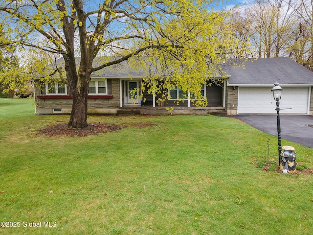 ranch-style house with a garage, driveway, and a front lawn