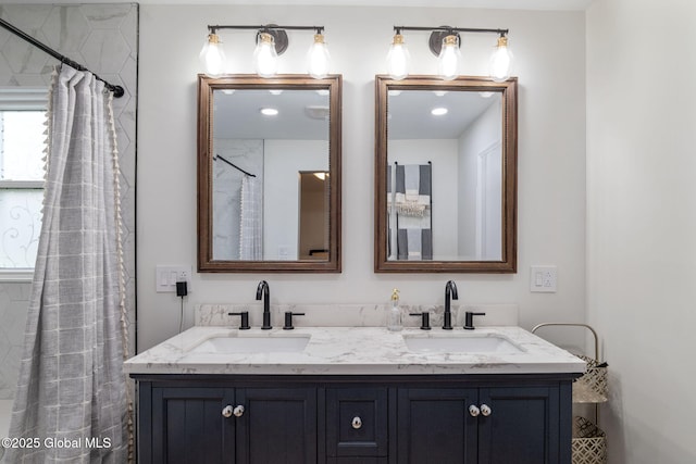 bathroom featuring a sink and double vanity