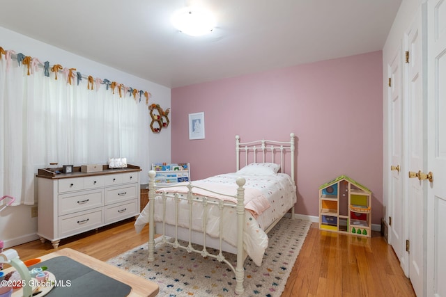 bedroom with light wood-style floors