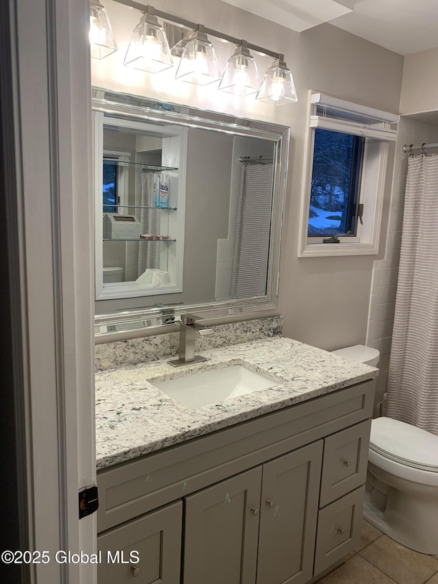 full bath featuring toilet, tile patterned flooring, vanity, and a shower with shower curtain