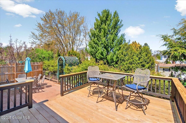 wooden terrace with outdoor dining area