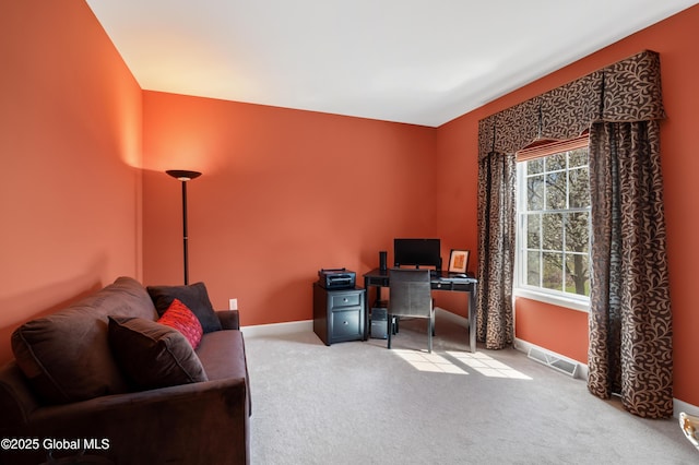 office area featuring visible vents, carpet, and baseboards