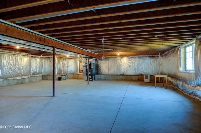 basement featuring heating unit