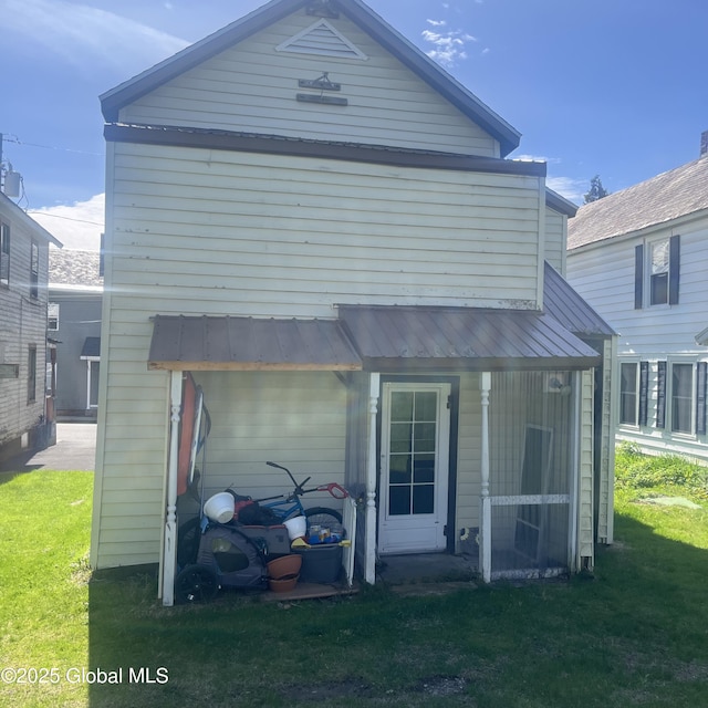 21 Depot St, Greenwich, NY 12834 - back of house featuring a lawn and metal roof