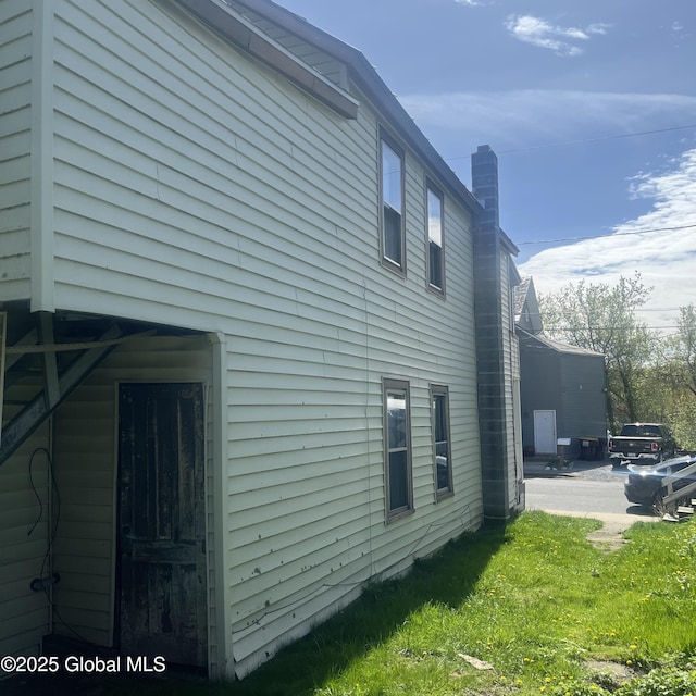21 Depot St, Greenwich, NY 12834 - view of side of property featuring a chimney