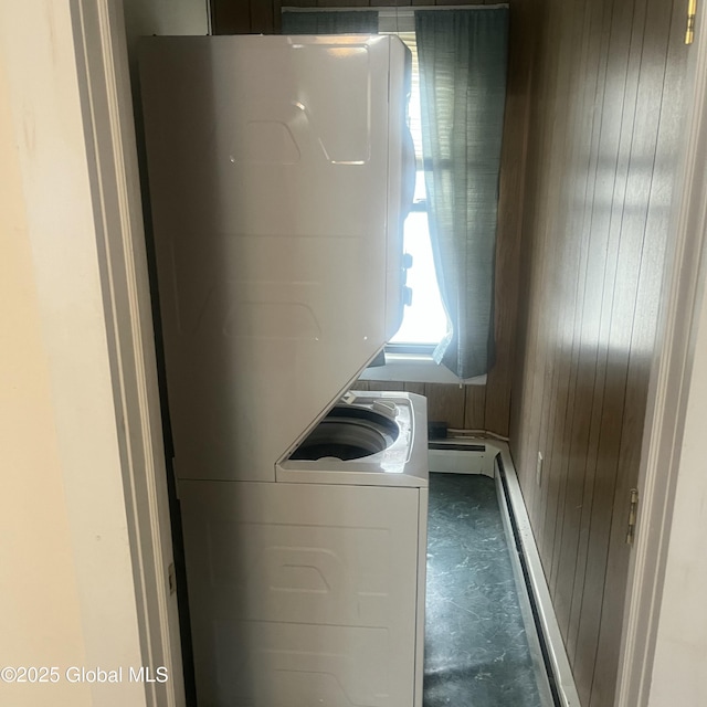 21 Depot St, Greenwich, NY 12834 - laundry room featuring estacked washer and dryer and wood walls