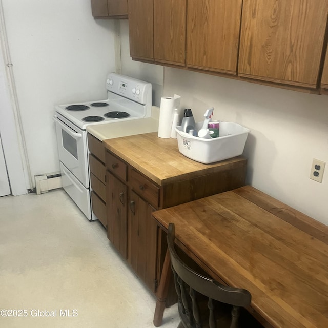 21 Depot St, Greenwich, NY 12834 - kitchen with white electric range, wood counters, baseboard heating, and brown cabinets