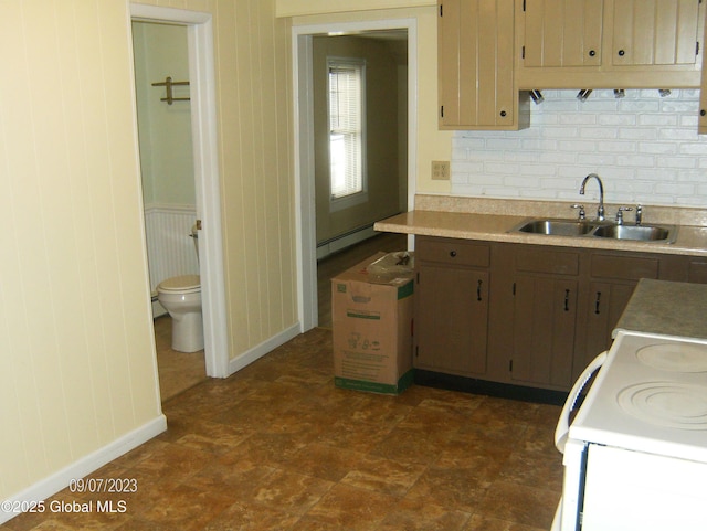 21 Depot St, Greenwich, NY 12834 - kitchen with a sink, a baseboard heating unit, backsplash, white range with electric stovetop, and baseboards