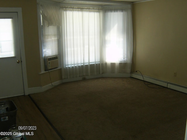 21 Depot St, Greenwich, NY 12834 - carpeted spare room featuring cooling unit, healthy amount of natural light, baseboards, and baseboard heating